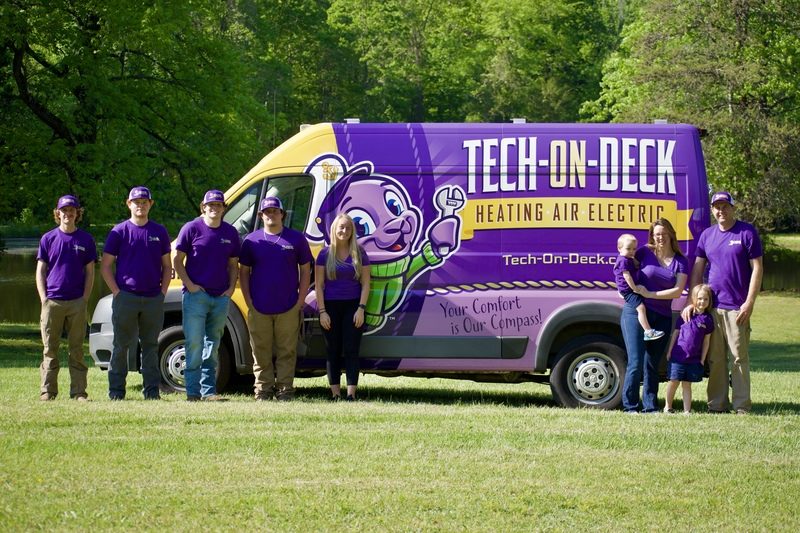 Tech on Deck HVAC Company & electrician team standing in front of their van